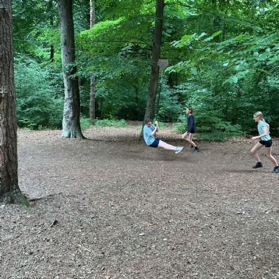 Child on zip line and children running